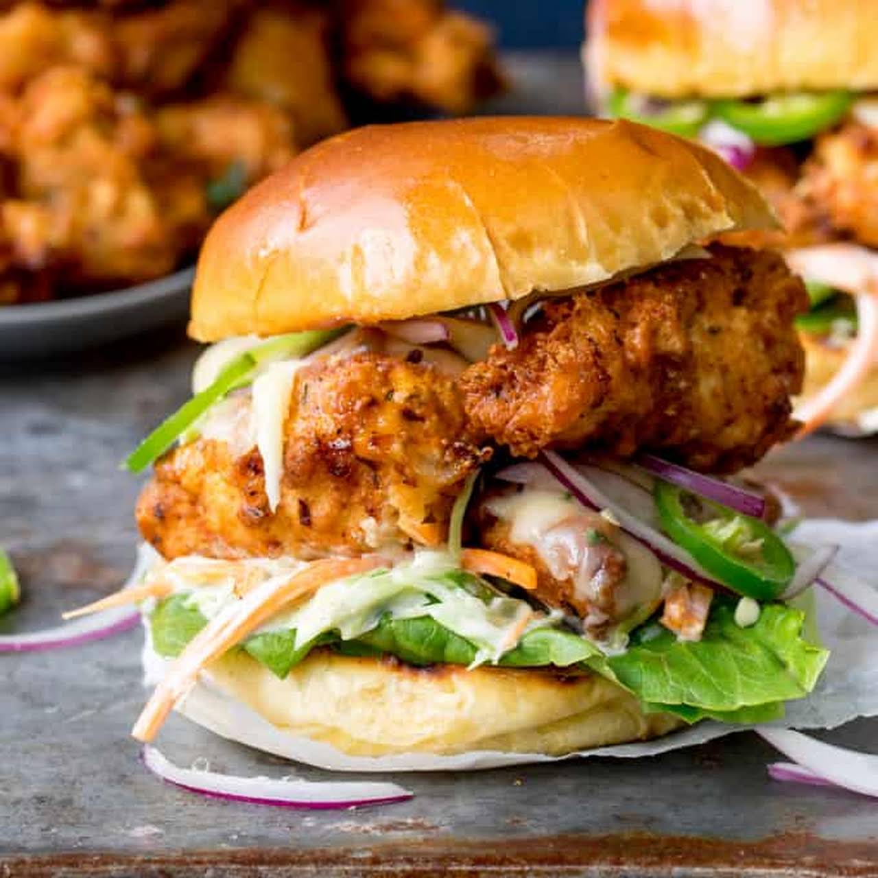 Crispy Chicken Burger  behind Honey Mustard Coleslaw